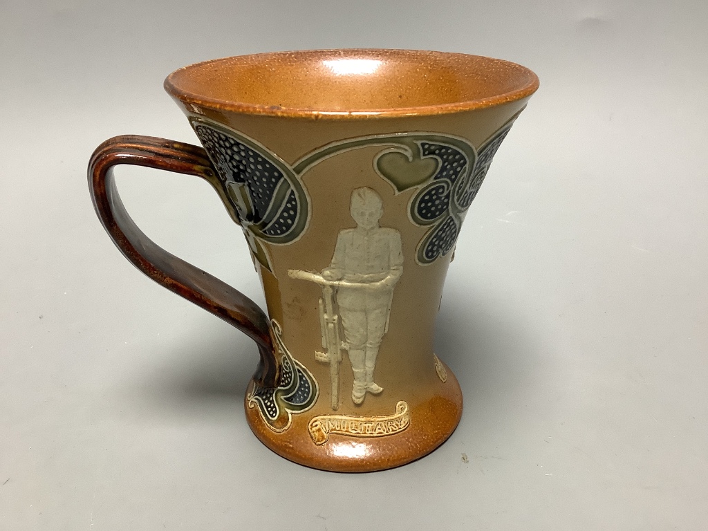 A Doulton Lambeth cycling related stoneware mug, c. 1900, height 12cm